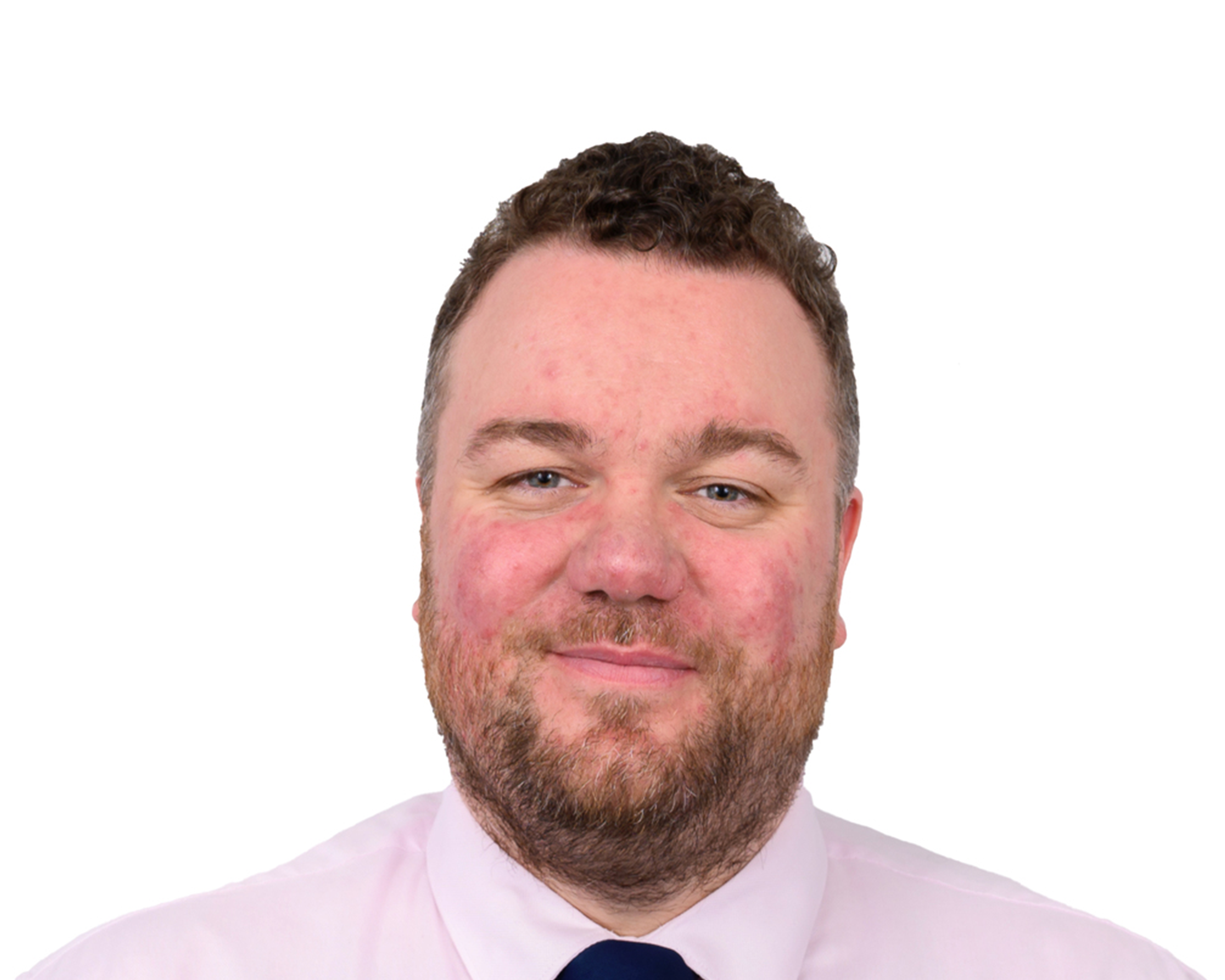 Professional headshot photograph of a person wearing a light pink shirt and dark tie against a plain white background, typical of official school staff or identification photos.