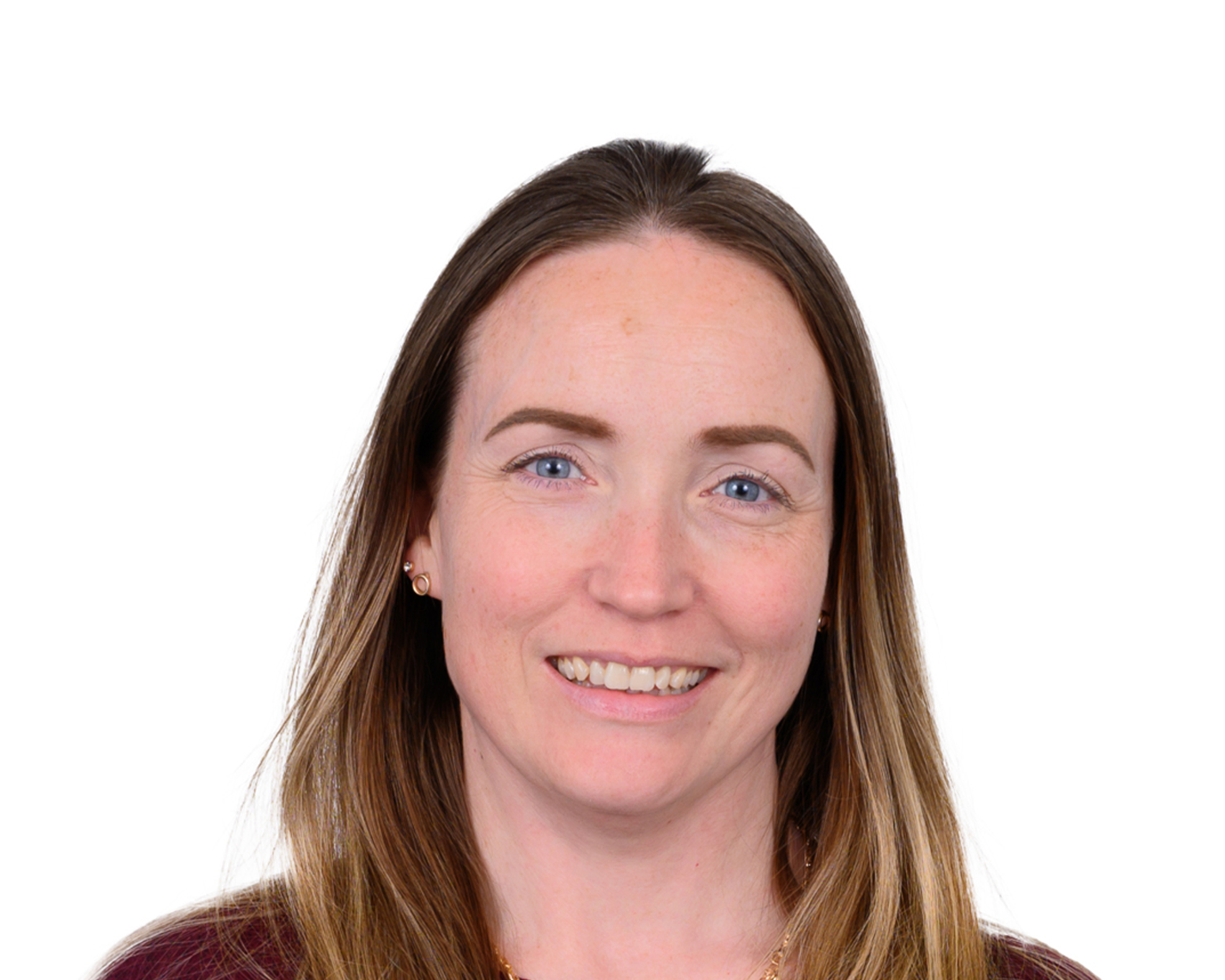Professional headshot photograph of a staff member against a plain white background, smiling at the camera.